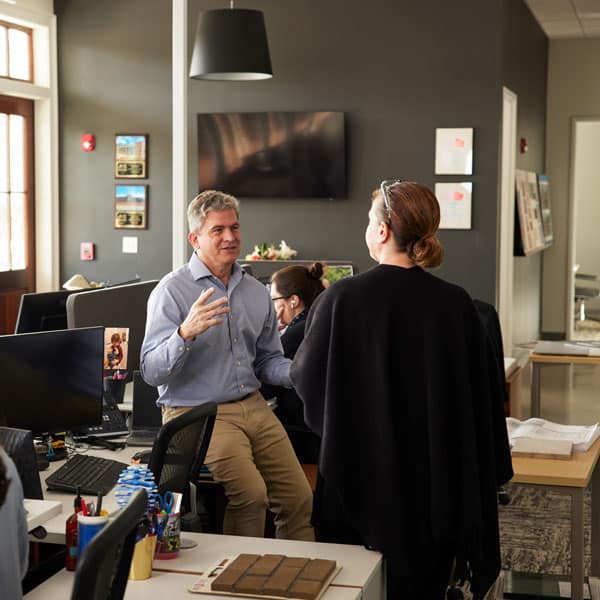 Careers-2b Jericho team collaborating in open area at Jericho Design